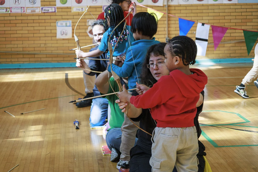 Young people at a Hidden Gems archery program